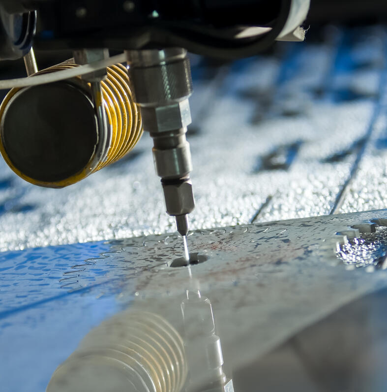 World-class Omax Water jet cutting machine used to cut a design through flat steel material by AquaJet Profiles in Johannesburg South.